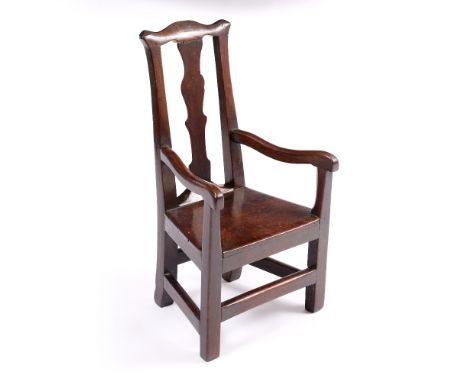 AN ANTIQUE ELM CHILD'S OPEN ARMCHAIR with shaped splat back, solid seat and legs united by stretchers, 37cm wide x 73.5cm hig