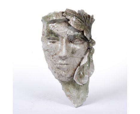 A GRECIAN CERAMIC WALL MASK  raku fired, 19cm wide x 31cm high