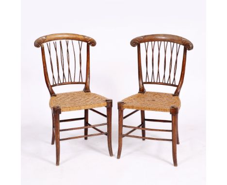 A PAIR OF SMALL WALNUT OCCASIONAL CHAIRS with scroll decoration to the cresting rails, intertwined stick splats and cane seat