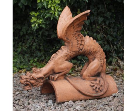 A LARGE 20TH CENTURY TERRACOTTA ROOF RIDGE TILE surmounted by a dragon on a half round tile, 66cm long x 67cm high