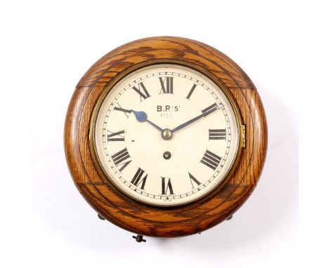AN 8" OAK RAILWAY DIAL TIMEPIECE with Roman numerals, inscribed B. R (S) 11001, signed Smiths Made in England with blued stee
