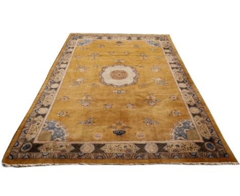 A LARGE GOLD GROUND TURKISH ESPARTA CARPET with floral decoration, c.1920, approximately 680cm x 450cm