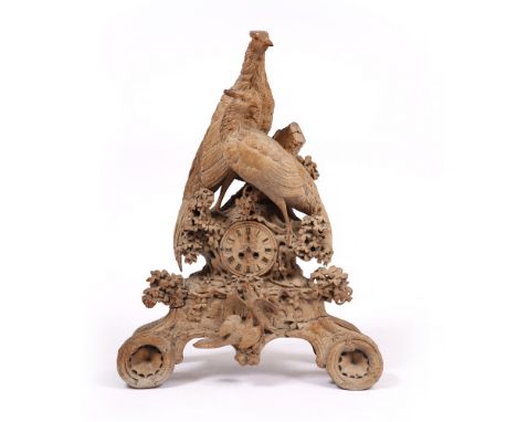 A LARGE 19TH CENTURY BLACK FOREST CARVED PINE MANTLE CLOCK the case carved with two pheasants standing by a tree stump and wi