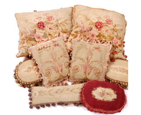 A GROUP OF EIGHT FRENCH TAPESTRY STYLE CUSHIONS all with floral decoration, the largest 40cm square (8)