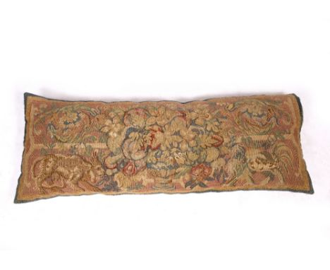 A 19TH CENTURY TAPESTRY WINDOW CUSHION decorated with mystical creatures and foliage, 95cm x 31cm