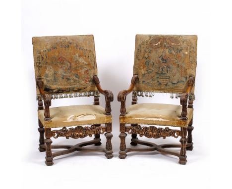 A PAIR OF CAROLEAN STYLE STAINED BEECHWOOD OPEN ARMCHAIRS with antique tapestry upholstered backs, acanthus leaf scroll decor