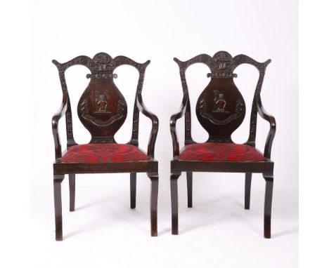 A PAIR OF 19TH CENTURY CANTONESE HARDWOOD CARVER ARMCHAIRS with cresting rails and back supports, carved with dragons and luc