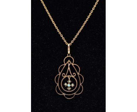 A 9CT GOLD EDWARDIAN PENDANT NECKLACE, the pendant of an openwork scrolls and scallop edge design, suspending a central Malte