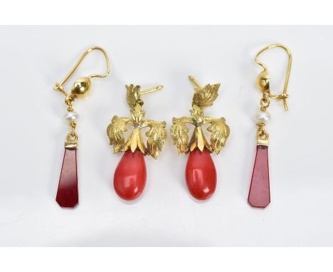 TWO PAIRS OF YELLOW METAL DROP EARRINGS, the first pair each designed with a carved carnelian elongated panel, interspaced wi