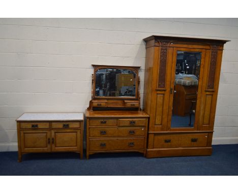 AN EARLY 20TH CENTURY ART NOUVEAU POLLARD OAK THREE PIECE BEDROOM SUITE, comprising a single mirror door wardrobe, with an ov