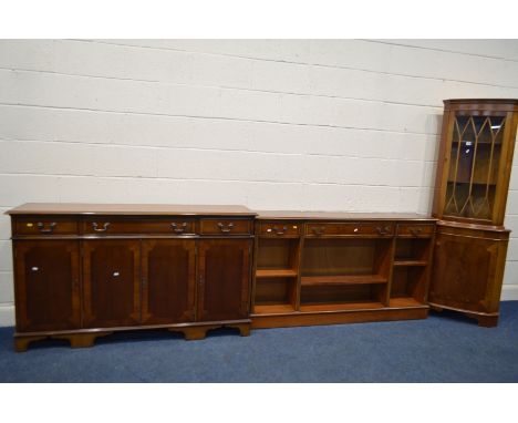 A YEW WOOD SIDEBOARD, with three drawers with triple section bookcase below, together with another sideboard with three drawe
