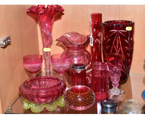 A SMALL GROUP OF CRANBERRY AND RUBY COLOURED GLASSWARE, mostly late 19th Century, some damage, including an onion shape vase 