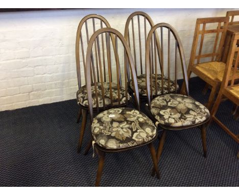 Set of four ercole stick back dining chairs.