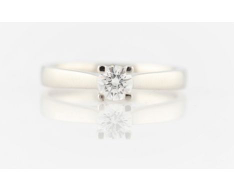 A hallmarked platinum diamond solitaire ring, set with a round brilliant cut diamond, measuring approx. 0.30ct, ring size M, 