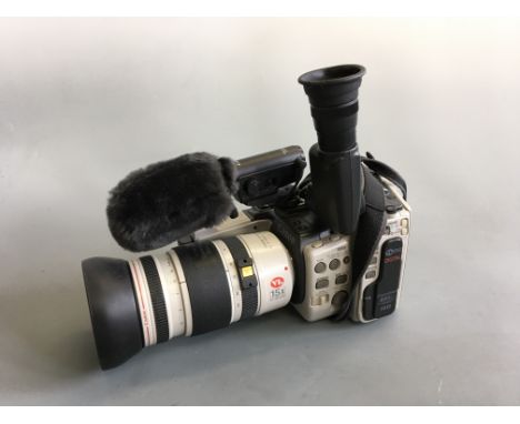 A Canon digital Hi 8 EX1 camera and lens with batteries.