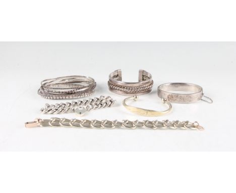 A collection of white metal jewellery, to include a hallmarked silver hinged bangle, a curb link bracelet with heart padlock 