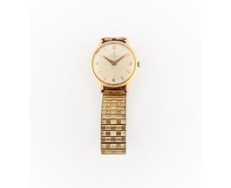 A gents Zenith wrist watch, the champagne tone dial having hourly arrow markers with quarterly Arabic numerals, with minute t