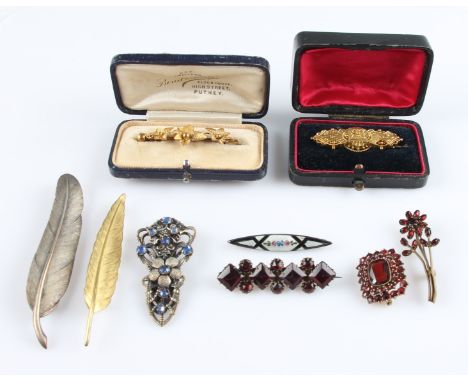 A collection of eight brooches, to include a hallmarked 15ct yellow gold Victorian memorial brooch, an ivy leaf design brooch