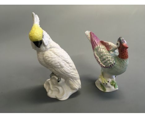 Two Crown Staffordshire birds, one Cockatoo signed J.T. Jones, with one Chinese Jeal signed M Doubell Miller.