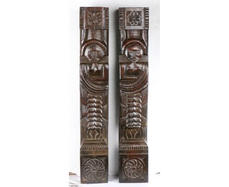 Of slightly naive form, one a male, the other female, each with naked torso, one arm folded into a sash, topped by an eight-p