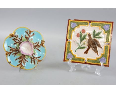 George Jones majolica six well oyster plate decorated with seaweed and a shell, marked with registration mark and GJ to base,