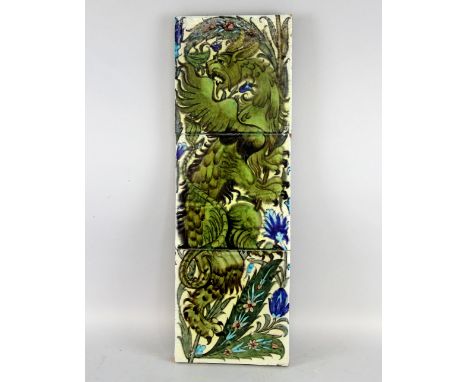 A three tile panel attributed to William de Morgan, in Persian style with painting of a Griffin among flowers and foliage, cl