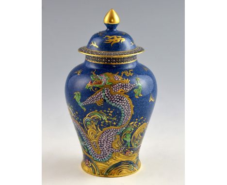 New Chelsea blue ground jar and cover decorated with a dragon in blue and green enamel with gilt highlights and finial, marke