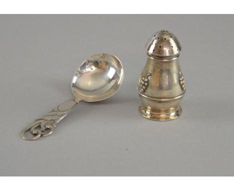 Danish silver caddy spoon with leaf decorated handle, dated 1935, marks for Jens Sigsgaard, and a similar peperette, dated 19