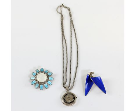 Two Norwegian blue enamel brooches, one in the form of a flower, with floral locket on double chain, all stamped 925 (3).    