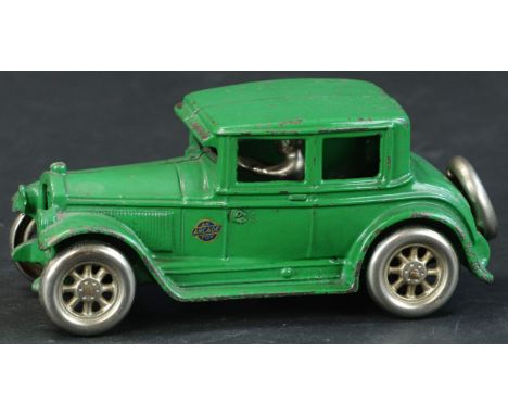 273. ARCADE BUICK COUPE | Desirable and scarce example from the 1929 series, painted in green with nickel wheels and spare on