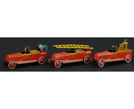 23. THREE FISCHER FIRE ENGINE PENNY TOYS | Provenance: Paul Cole Collection. | 3" l. | Overall (Excellent Condition) | $300 -