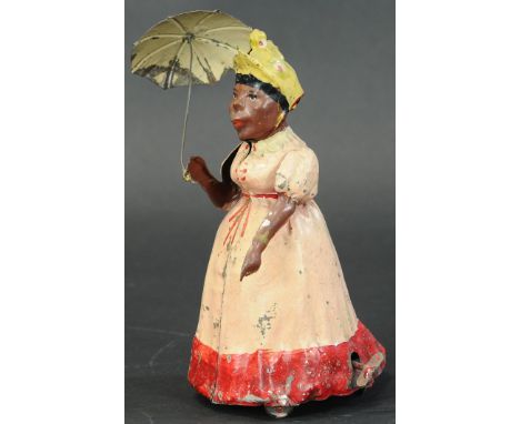 114. HANS EBERL WOMAN W/ UMBRELLA | Nice German toy with a large shelf presence, hand painted tin, key wound with a bellows e