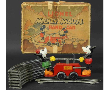 824. LIONEL #1100 MICKEY MOUSE IN RED | O gauge, wind up. Provenance: Paul Cole Collection. | 8" l. | Clockwork needs repair,