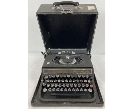 A vintage manual Olivetti Studio 42 typewriter with British Olivetti Ltd. Glasgow nameplate to front. Complete with hard case