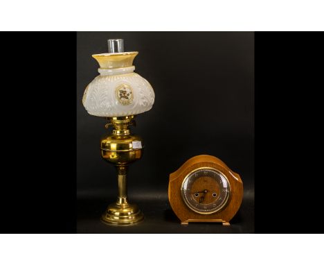 A Duplex Brass Oil Lamp with glass shade. Made in England. Measuring 21 inches in height. Together with a Smiths Enfield 1950