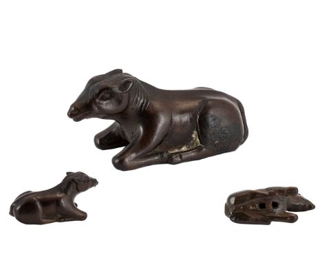 Antique Wood Japanese Netsuke of fine patination, depicting a reclining horse.  Unsigned.  Measures 2'' long and .75'' tall. 