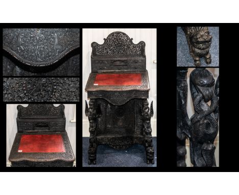 Anglo Indian Antique Profusely Carved Teak Davenport with top superstructure with drawers, decorated with peacocks amongst ex