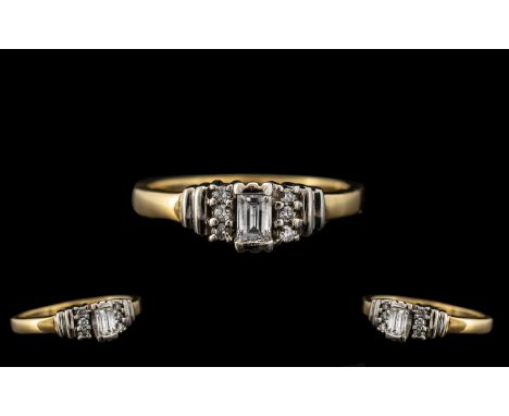 18ct Gold Diamond Ring set with a central fancy cut diamond set between six round brilliant cuts. Fully hallmarked. Est diamo