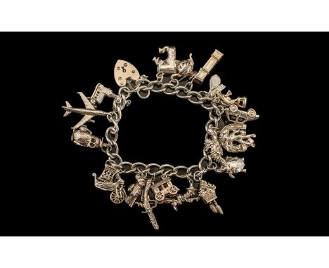 A Vintage Silver Charm Bracelet, Loaded with 21 Solid Silver Charms. Both Bracelet and Charms Marked for Sterling Silver. Wei