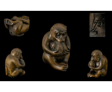 Oriental Carved Boxwood Netsuke, Depicts a Seated Figure of a Monkey Eating a Large Nut. Signed to Underside of Figure. Excel