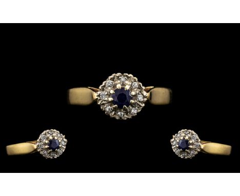 9ct Gold Dress Ring Central Sapphire Surrounded By 8 Round Cut Diamonds, Fully Hallmarked, Ring Size T, Weight 2.5 grams.