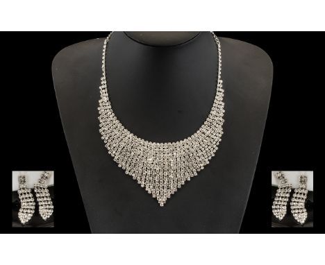 White Crystal Bib Necklace and Drop Earrings Set, a V shaped panel fully set with brilliant white crystals to the front of th