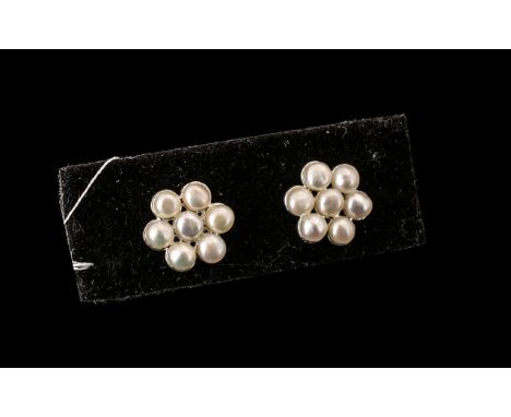 Cultured Fresh Water Pearl Flower Earrings, each single flower comprising seven fresh water white seed pearls set in silver p