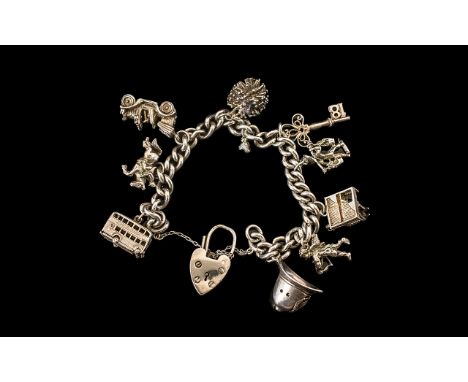Silver Curb Bracelet Loaded with Eight Good Quality Vintage Silver Charms. Both Bracelet and Charms Marked for Sterling Silve
