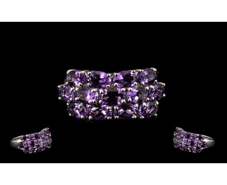 Amethyst Three Row Cluster Ring, 5.5cts of oval cut, deep purple amethysts set in three rows in platinum vermeil and silver; 