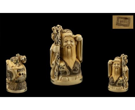 Japanese Early 20th Century Carved Ivory Netsuke of a Wiseman / Sage with Staff signed to underside, in excellent condition a