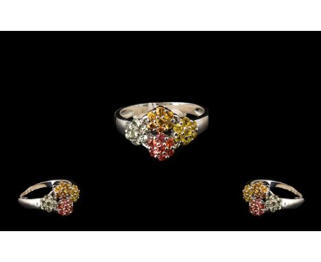 Yellow, Orange, Sunset and Green Sapphire Ring, four flower heads, one in each of the fancy sapphire colours, yellow, orange,