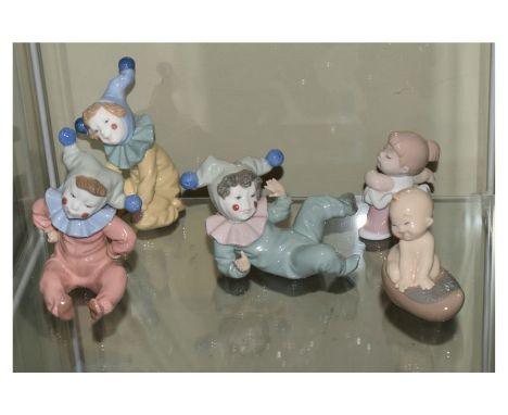 Five various Spanish Nao porcelain figurines modelled as clown children (3) and babies (2), largest 13.5cm high (5)  