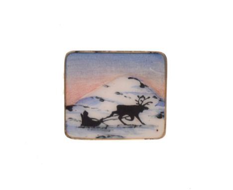 Scandinavian Sterling silver and enamel brooch decorated with a reindeer pulling a sled in a snowy landscape, stamped 925S ve