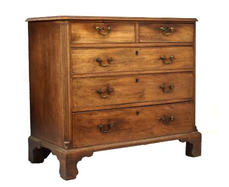 George III mahogany chest of two short over three long graduated drawers having canted fluted corners and bracket feet, 106cm